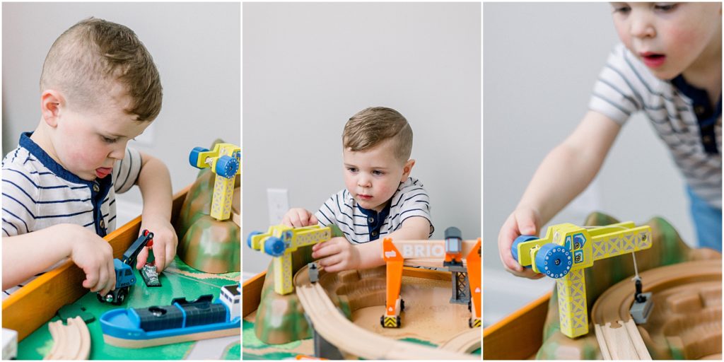 Family photographer captures little boy playing with his train table in Newnan, Georgia