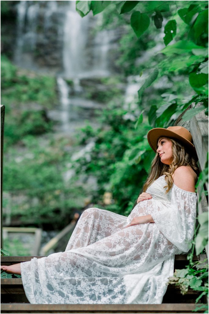 Maternity photos in front of waterfall