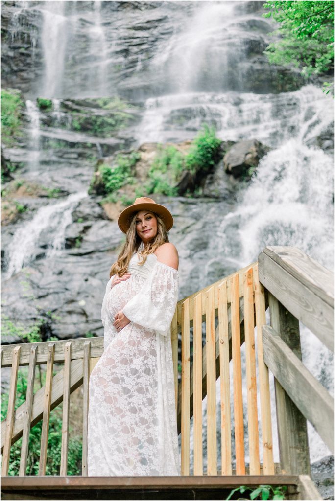 Mother to be in front of waterfall in Georgia