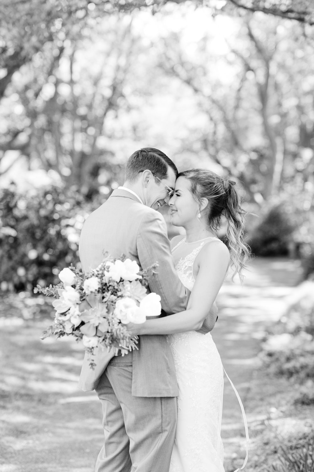 Bride and Groom being romantic at their Hahn Garden Wedding at Virginia Tech