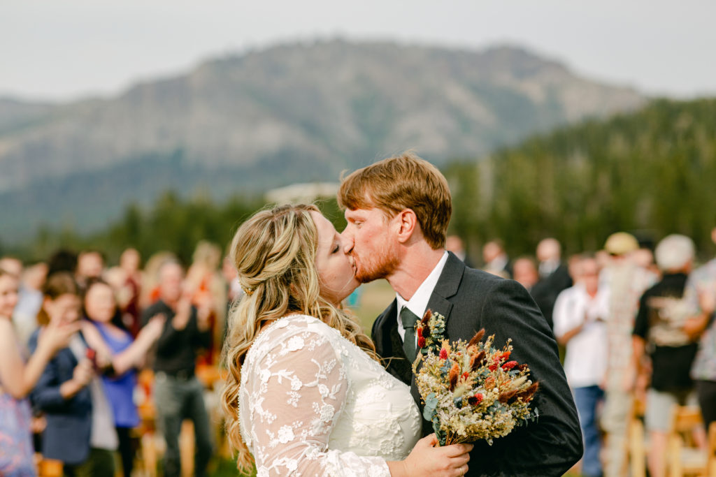 Couple kissing at their Plasse's Resort Wedding In California