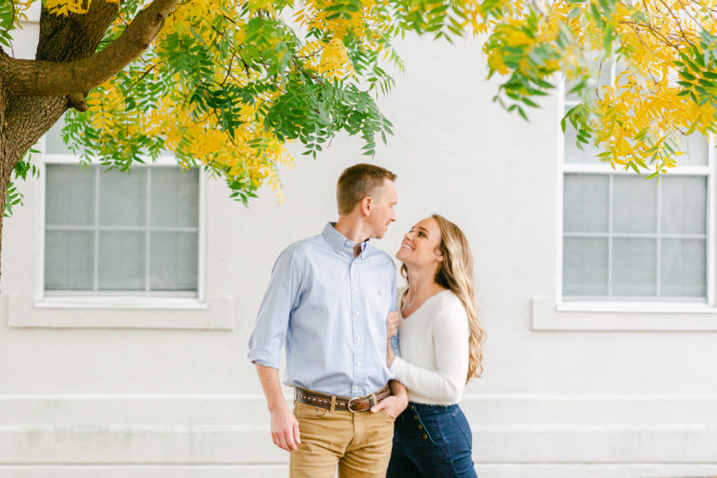 Couple's fun-loving and eclectic engagement session in Downtown Newnan in fall.