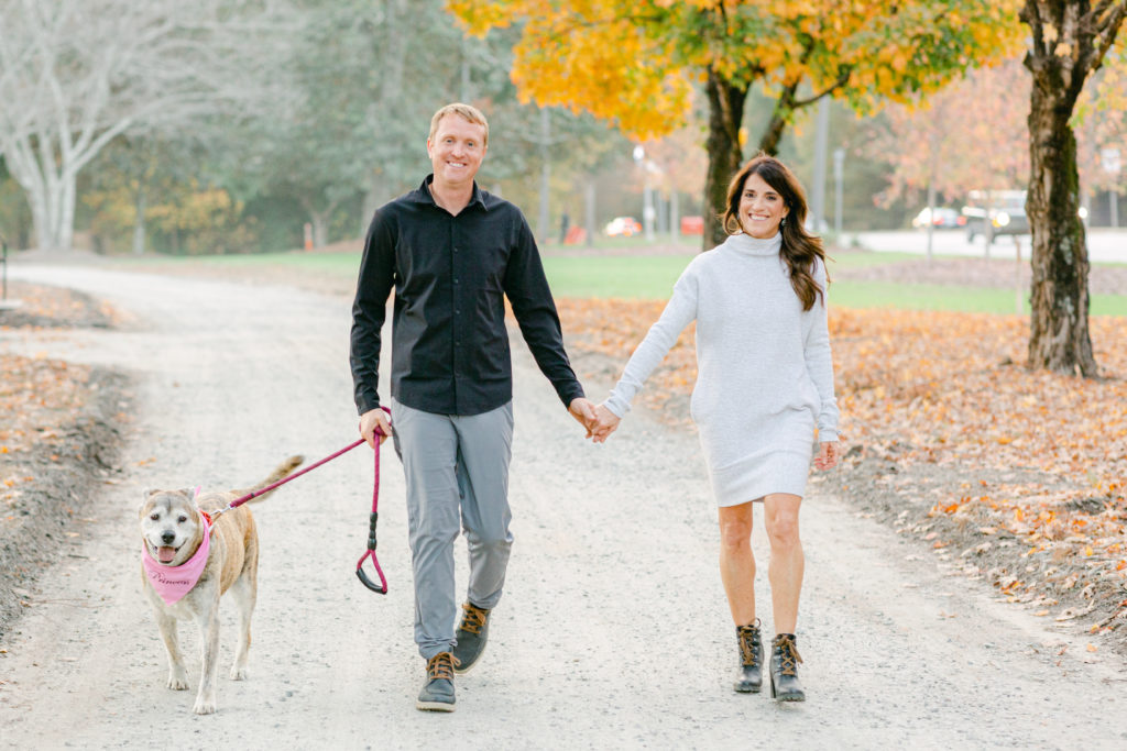 First image of a couple session in Peachtree City, Georgia where the couple includes their dog for the photos. 