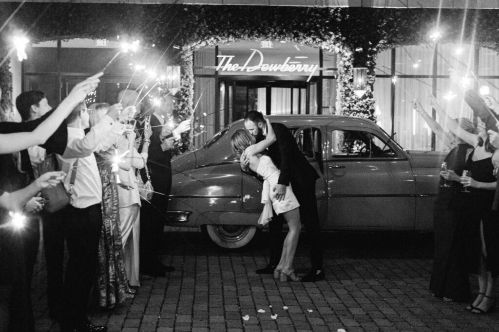 Bride and Groom kissing During their sparkler exit at their wedding at the Dewberry. 